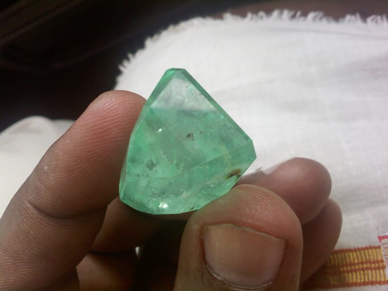 2.40 carat natural Panjshir emerald, cushion cut, showing vivid green color